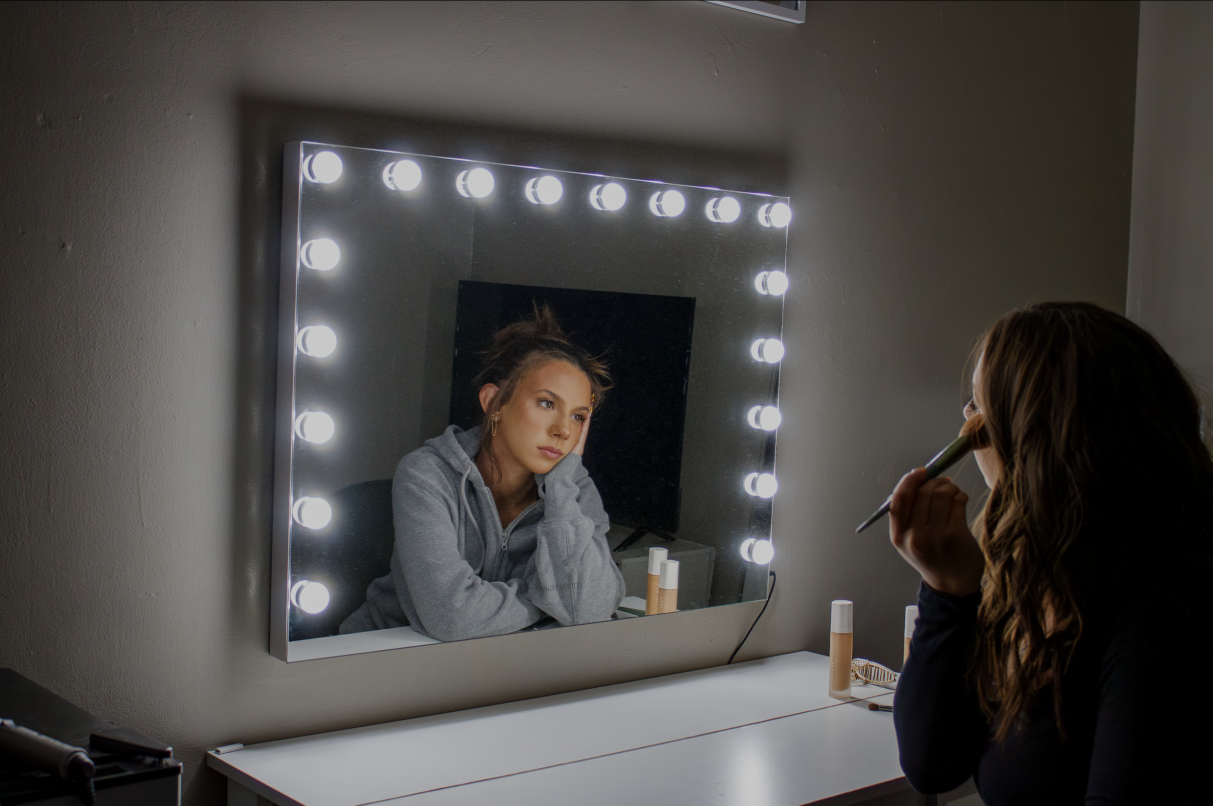 Photography of a mirror and a girl looking out of the mirror.